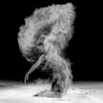 powder splashing beautiful woman face